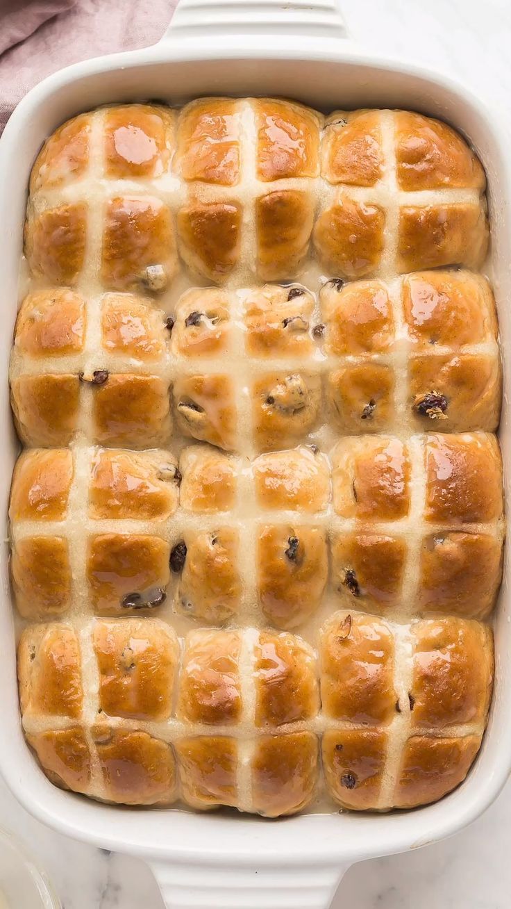 a casserole dish filled with hot cross buns