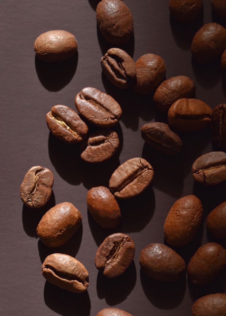 some coffee beans are laying on a table