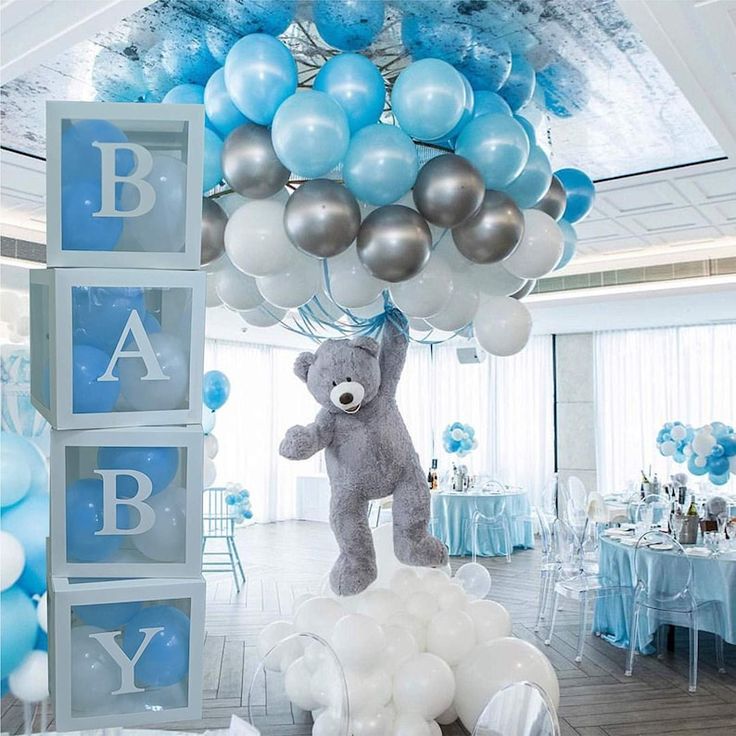 a baby shower with blue and silver balloons