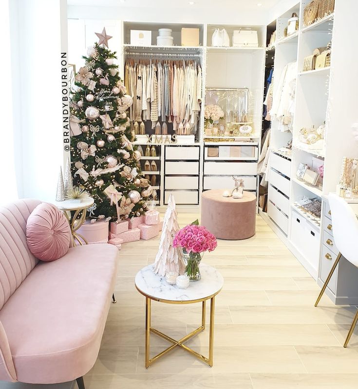 a living room filled with furniture and a christmas tree