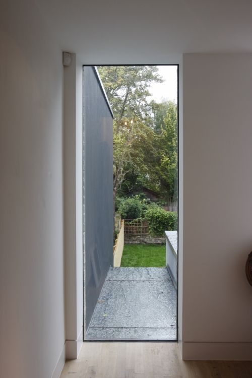 an open door leading to a backyard area