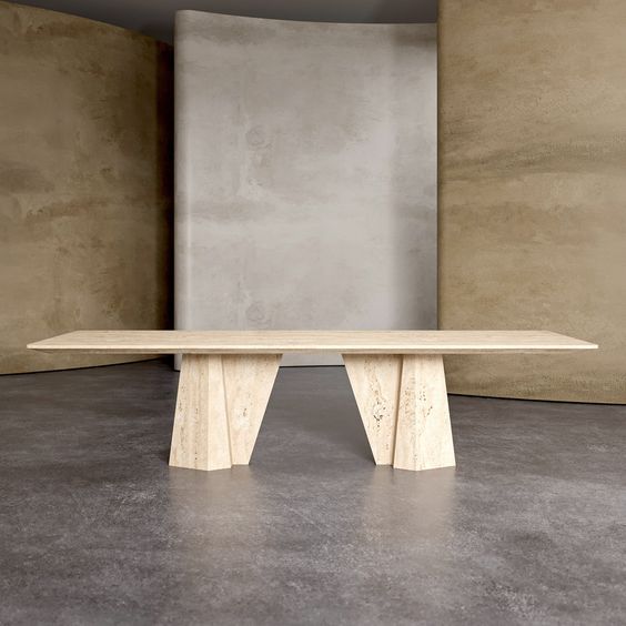 a wooden bench sitting in front of a cement wall and concrete floored area with no one around it