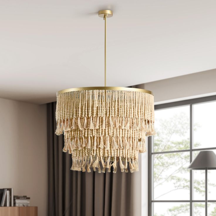 a chandelier hanging from the ceiling in a living room