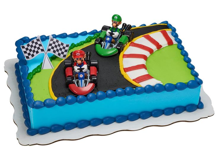 a birthday cake with an image of mario kart on the track and race cars