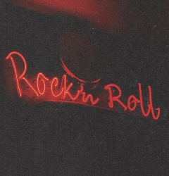 a red neon sign that reads rockin'roll