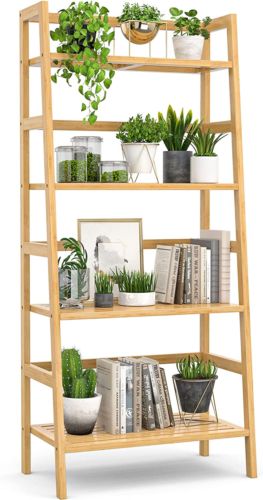 a wooden shelf filled with potted plants and books