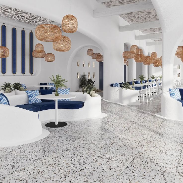 the interior of a restaurant with blue and white decor