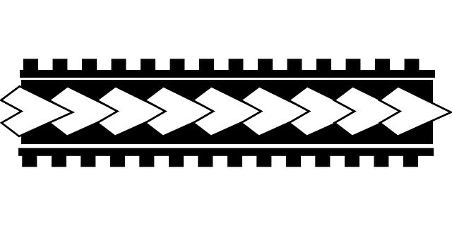 a black and white pattern with arrows on the bottom, in different directions to indicate where they are going