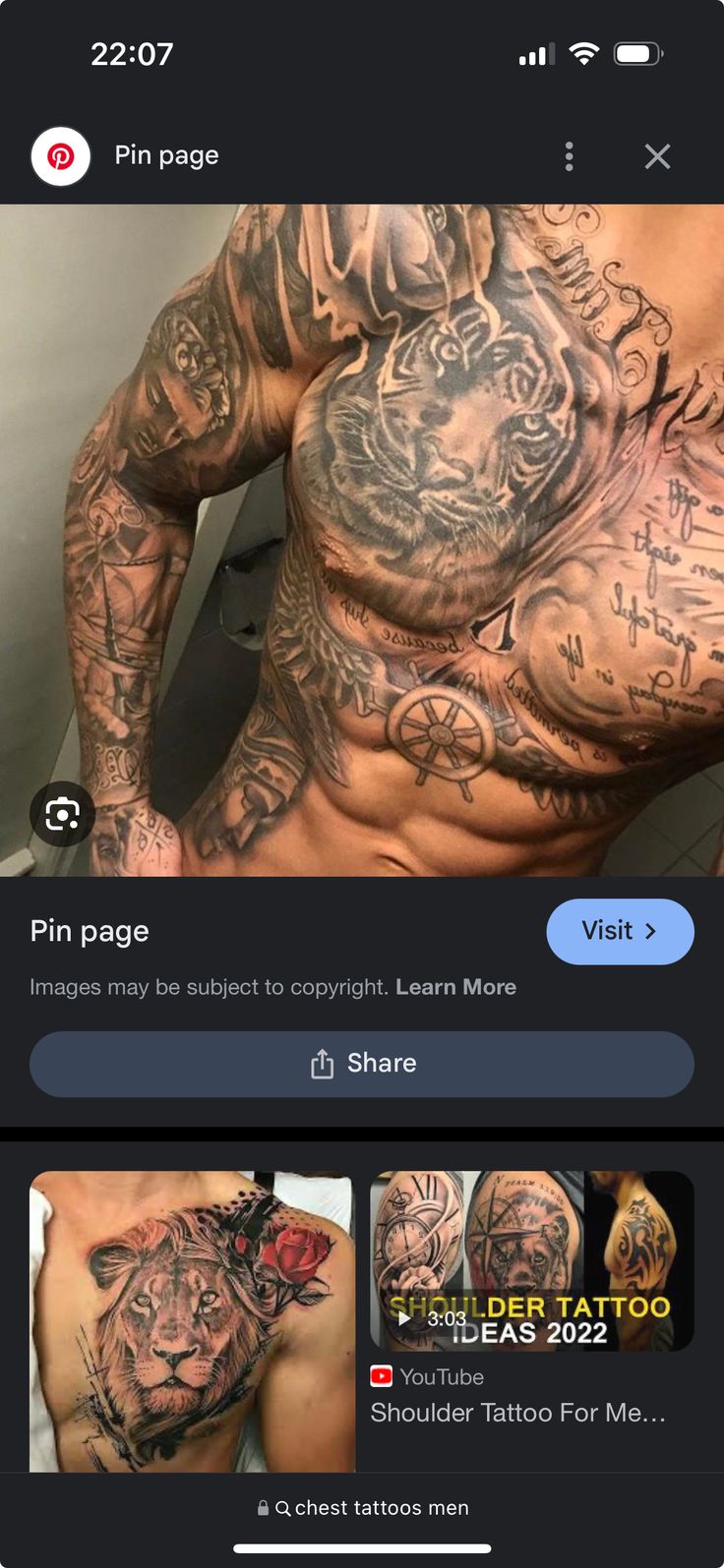 an image of a man with tattoos on his chest and arm, in the middle of a