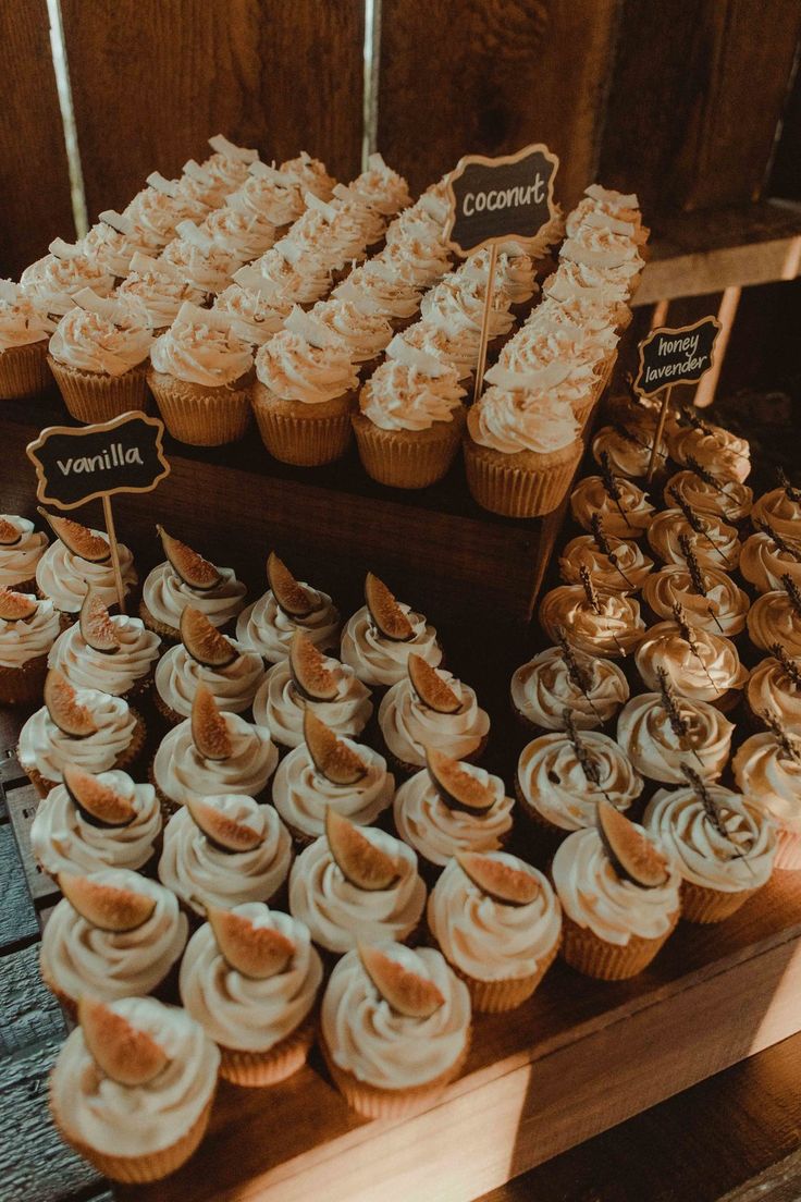 cupcakes and cookies on display at a wedding reception