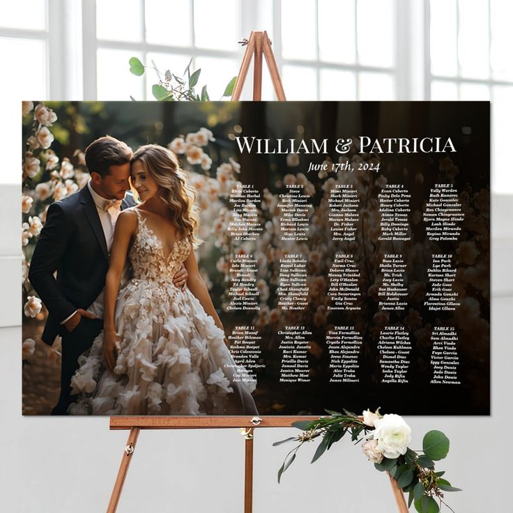 an easel with a wedding seating chart on it