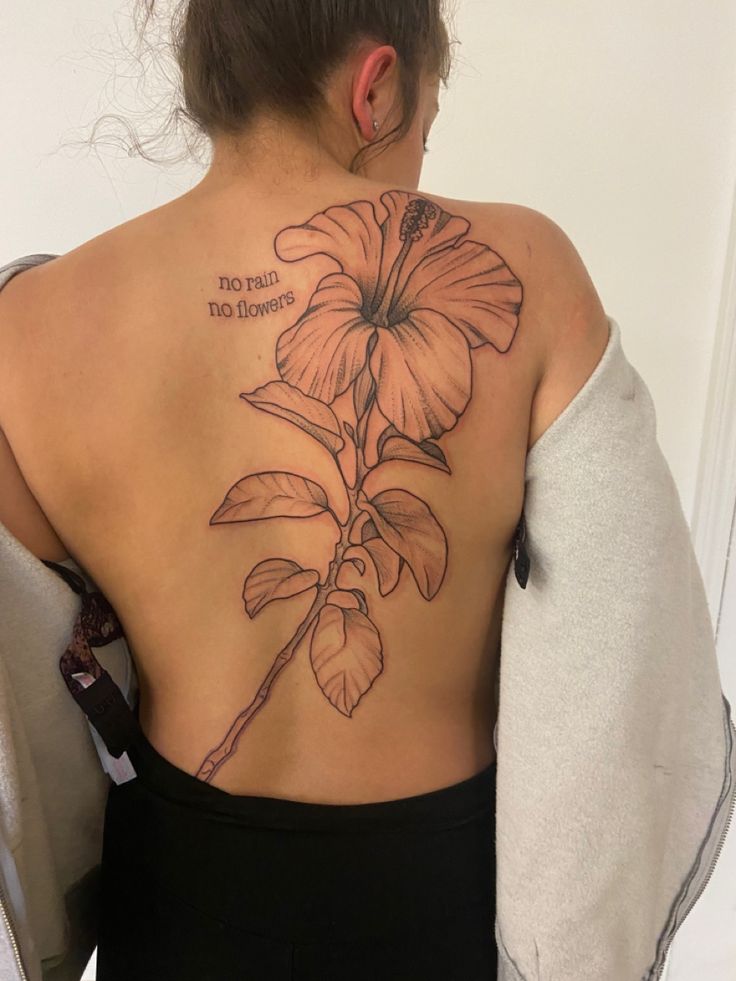 #tattoo #tattoosforwomen #hibiscusflower #norainnoflowers Hibiscus Tattoo On Ribs, Spine Tattoos For Women Hibiscus, Hibiscus Flower Back Tattoos, Hibiscus Bouquet Tattoo, Big Flower Back Tattoo, Hibiscus Back Tattoo, No Rain No Flowers Tattoo, Hibiscus Flower Tattoo, Skin Doodles