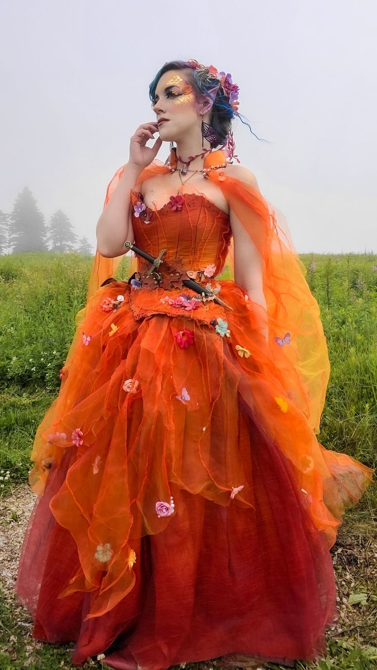 a woman in an orange dress is talking on her cell phone