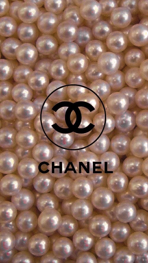 the chanel logo is on top of some pearl beads, which are white and black