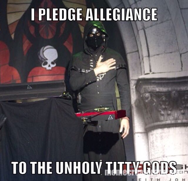 a man in a black uniform holding his arm up to his chest and the caption reads i pledge allegiance to the unholy tity gods