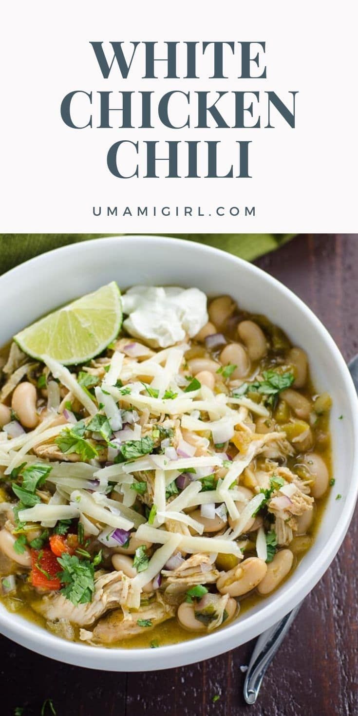 white chicken chili in a bowl with lime and cilantro