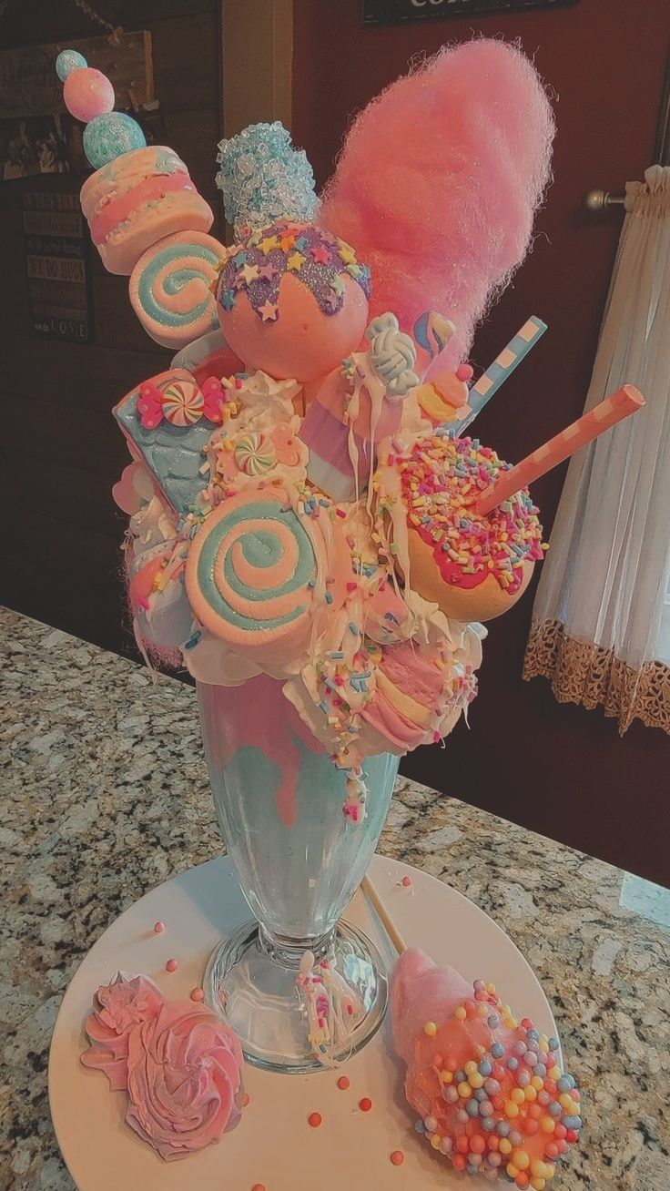 a vase filled with candy and candies on top of a table