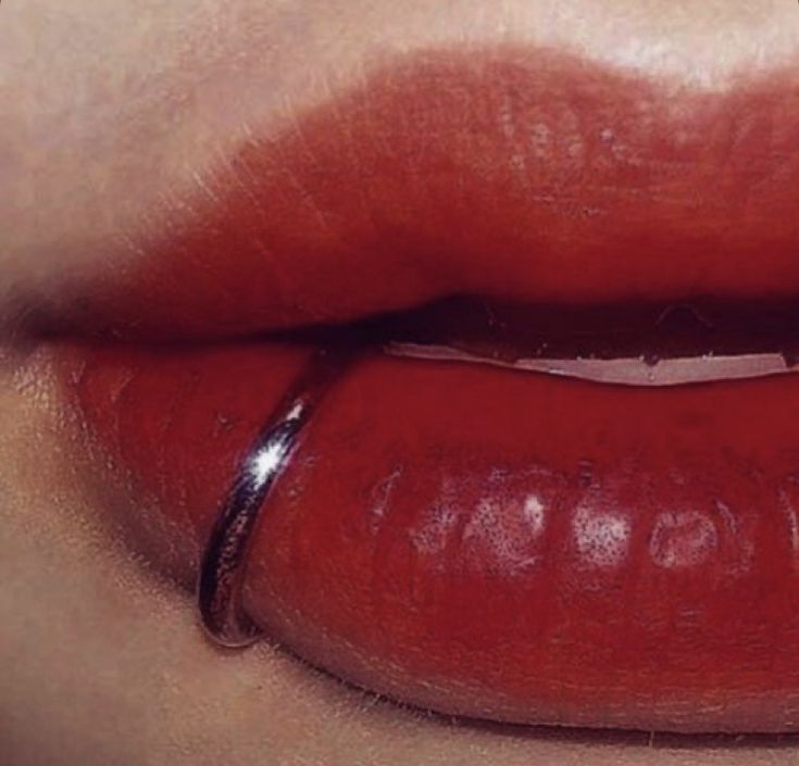 a woman's lips with red lipstick on them