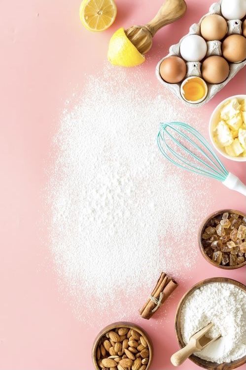 ingredients for baking laid out on a pink background