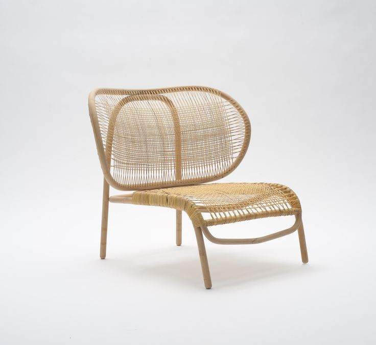 the chair is made out of wood and wicker