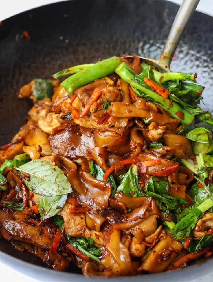 stir fry chicken with vegetables in a wok