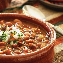 a close up of a bowl of food on a table