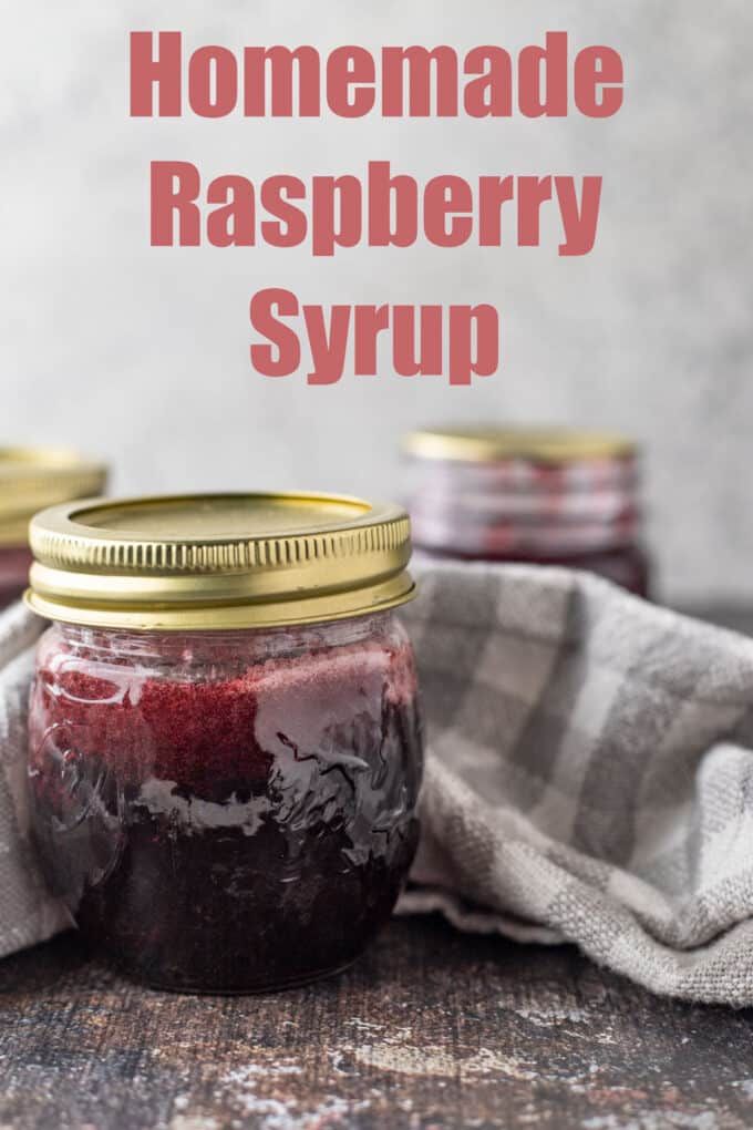 homemade raspberry syrup in a mason jar with text overlay that reads homemade raspberry syrup