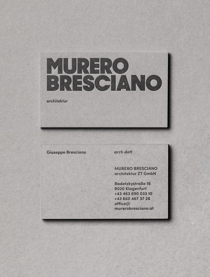 two business cards on top of each other