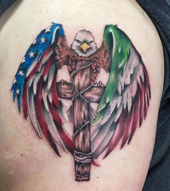 an eagle and cross tattoo on the back of a woman's shoulder