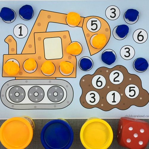 an image of a construction theme with numbers and dices on the table next to it