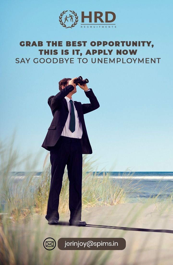 a man in a suit looking through binoculars