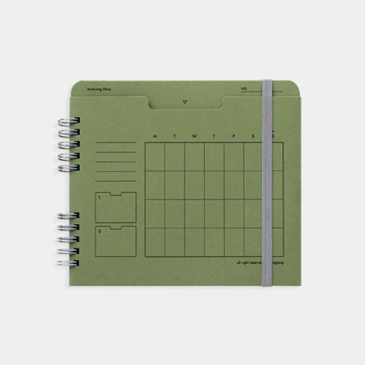 a spiral bound notebook with a green planner on the front and one page in the middle