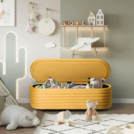 a child's room with toys and decor on the floor, including a toy chest