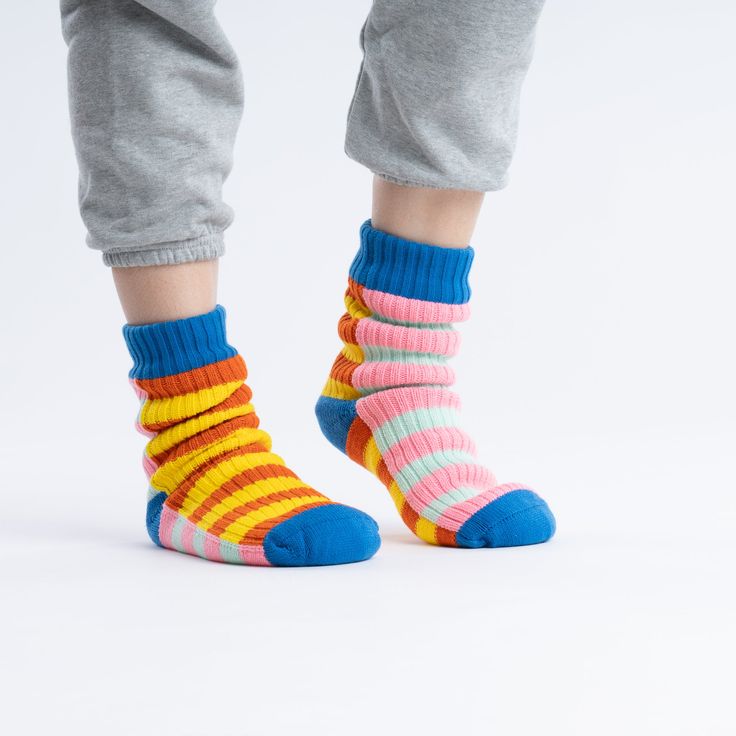 These unisex fleece-lined knit sock slippers are the best of both worlds! The easy fit of socks meets the plush comfort of house slippers. Our striped House Socks are meant to mix and match—and keep you cozy indoors. These soft knitted socks are fully lined with fluffy faux fleece for extra warmth. Slip-resistant patches on sole. Machine washable. Sizes S/M (Womens 6-9, Mens 5-7.5)L/XL (Womens 9.5-12.5, Mens 8-11) Details Body – 100% Soft AcrylicLining - Polyester FleeceMachine wash cold, dry fl Sock Slippers, House Socks, Knitted Socks, Animal Books, Cute Socks, Striped Socks, Ux Web Design, Dog Sweaters, Fabric Remnants