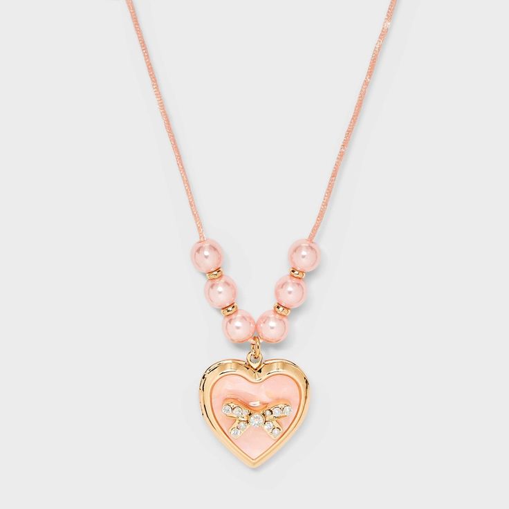 Style your little one with the charming Girls' Pink Bow Locket Necklace from Cat & Jack™ Pink. This cute necklace features a delicate pink bow for added style. Measuring 17 inches in length for a comfy fit, it's delicate and durable design makes it a great accessory for your little one to style with various outfits. Cat & Jack™: Designed for all children so you can trust it's made for yours. Heart Necklace For Kids, Elle Woods Heart Necklace, Preteen Necklace, Pink Adjustable Heart Necklace For Valentine's Day, Playful Pink Necklaces For Mother's Day, Playful Pink Necklace For Mother's Day, Cute Pink Heart Necklace For Mother's Day, Pink Adjustable Charm Necklace For Birthday, Birthday Baskets