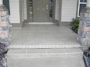 the front entrance to a house with steps leading up to it