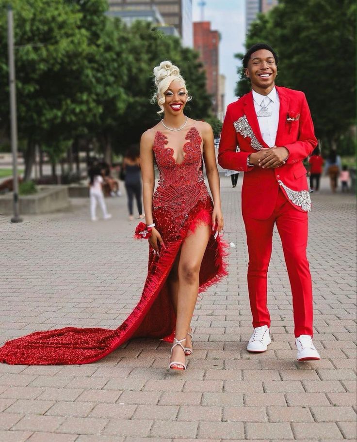 Red And Black Prom Ideas, Prom 2024 Black People, Red And White Prom Couples, Red Couple Outfits, Red Prom Ideas, Red Prom Dress Black Women, Dramatic Prom Dresses, Royal Blue Prom Suits, Red Prom Couple