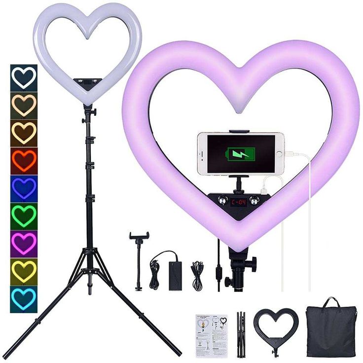 an image of a heart shaped light up with tripod and cell phone on it