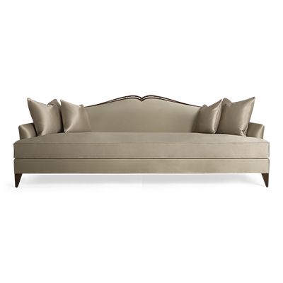 a beige couch with pillows on it