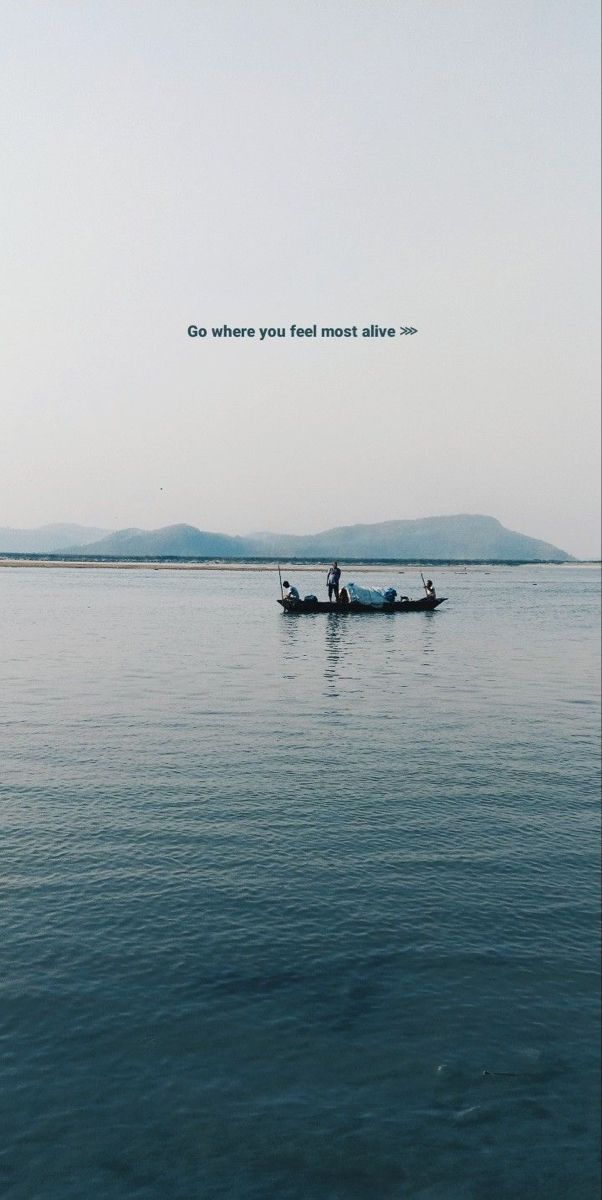 two people in a small boat on the water with an inspirational quote above them that reads, go where you feel most alive