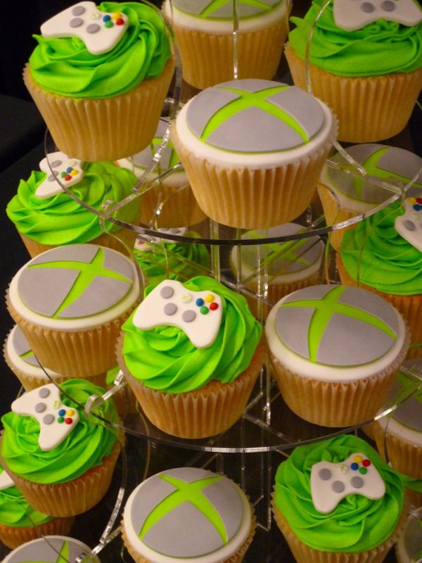 cupcakes with green frosting and video game controllers on them