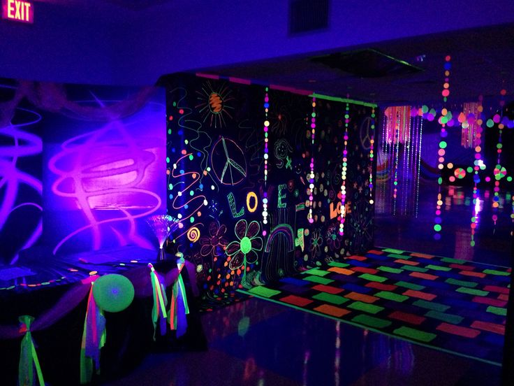 the room is decorated with neon lights and decorations