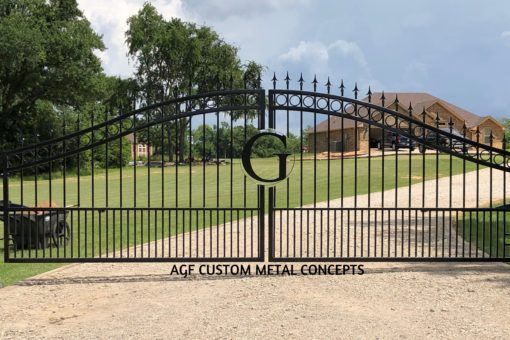 an iron gate with the words ace custom metal concepts on it in front of a house