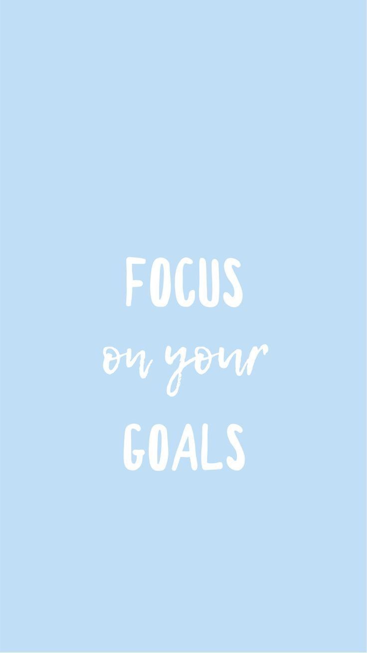 the words focus on your goals against a blue background with white lettering that reads, focus on your goals