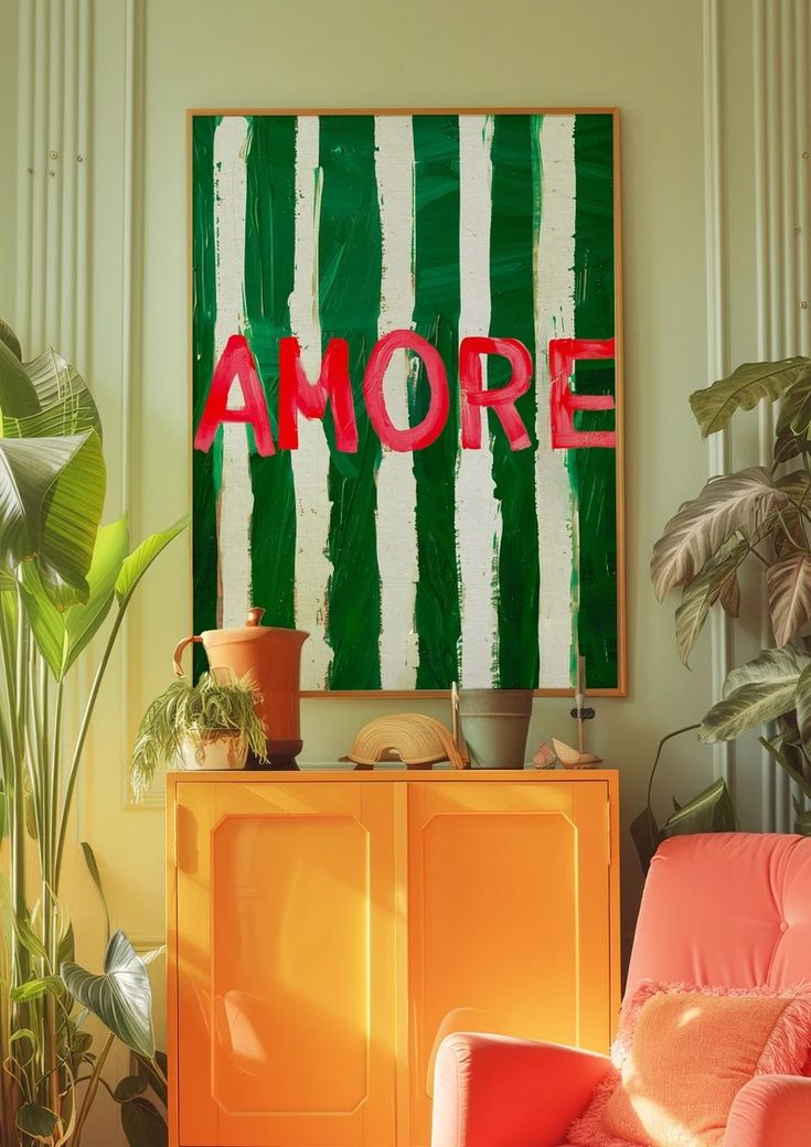 an orange chair in front of a green and white wall with the word amore on it