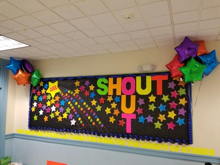 a bulletin board that says shut out with stars and streamers on the back wall