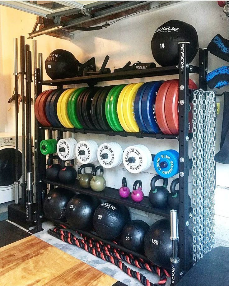 a rack filled with lots of different colored dumbbells