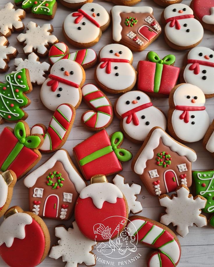 christmas cookies decorated with frosting and icing are on a table next to each other