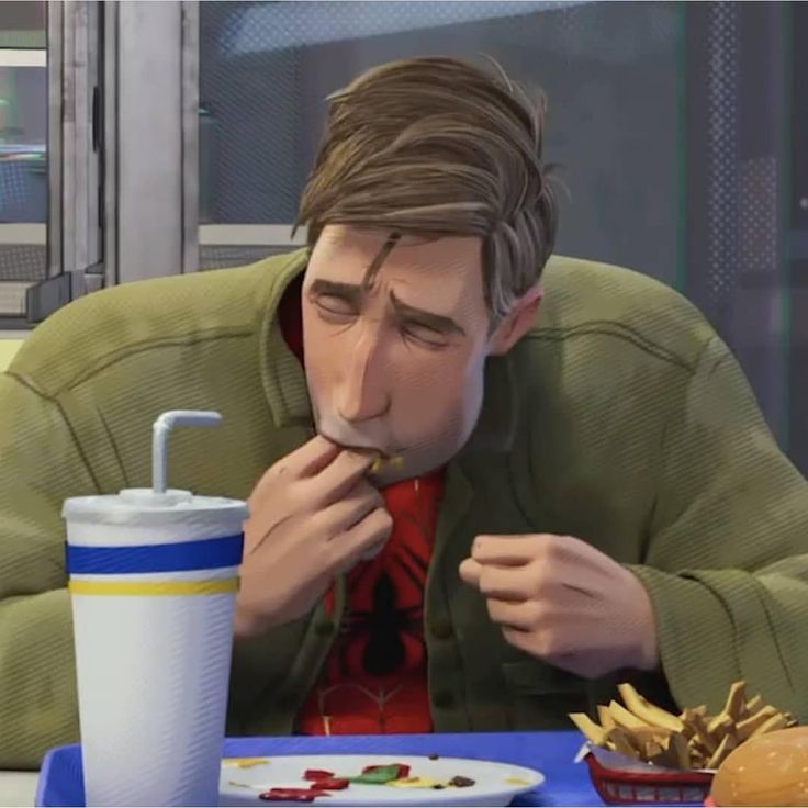 a man sitting at a table eating food