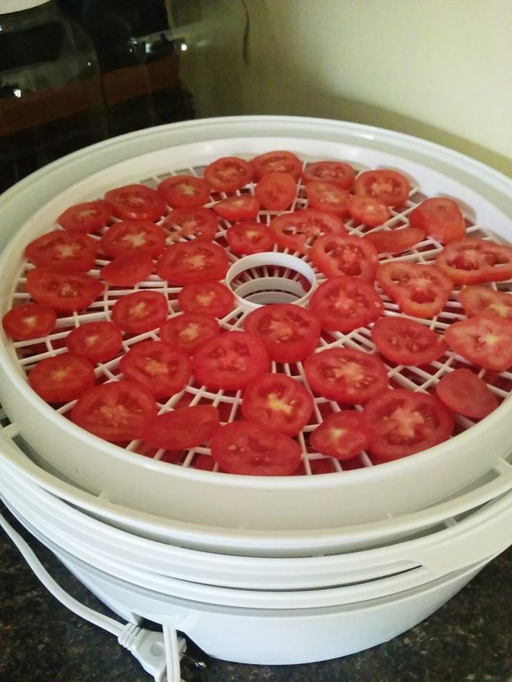 the tomatoes have been cut into small pieces and are placed in a circular basket on top of each other